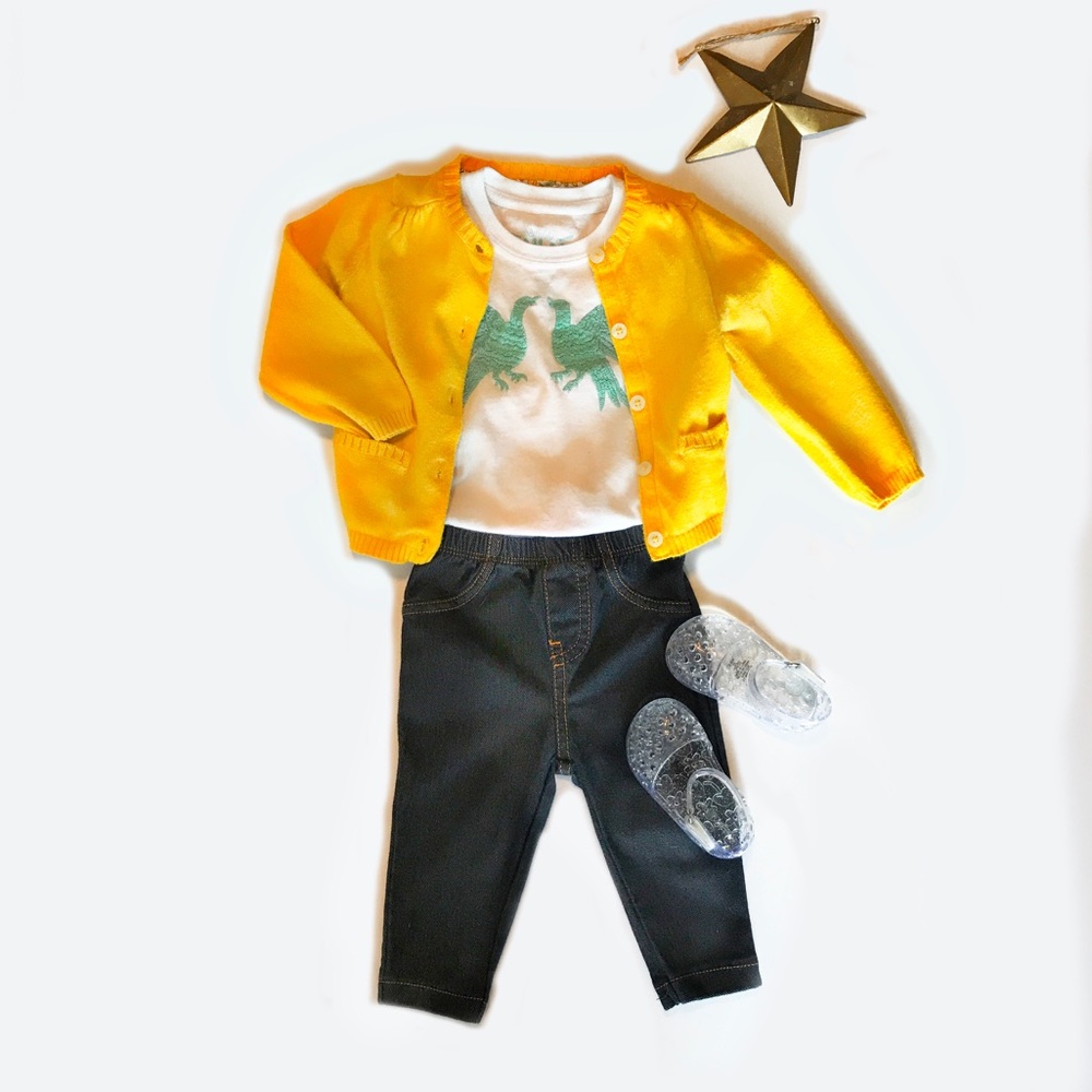 Bird T-shirt with sweater and stretchy blue jeans
